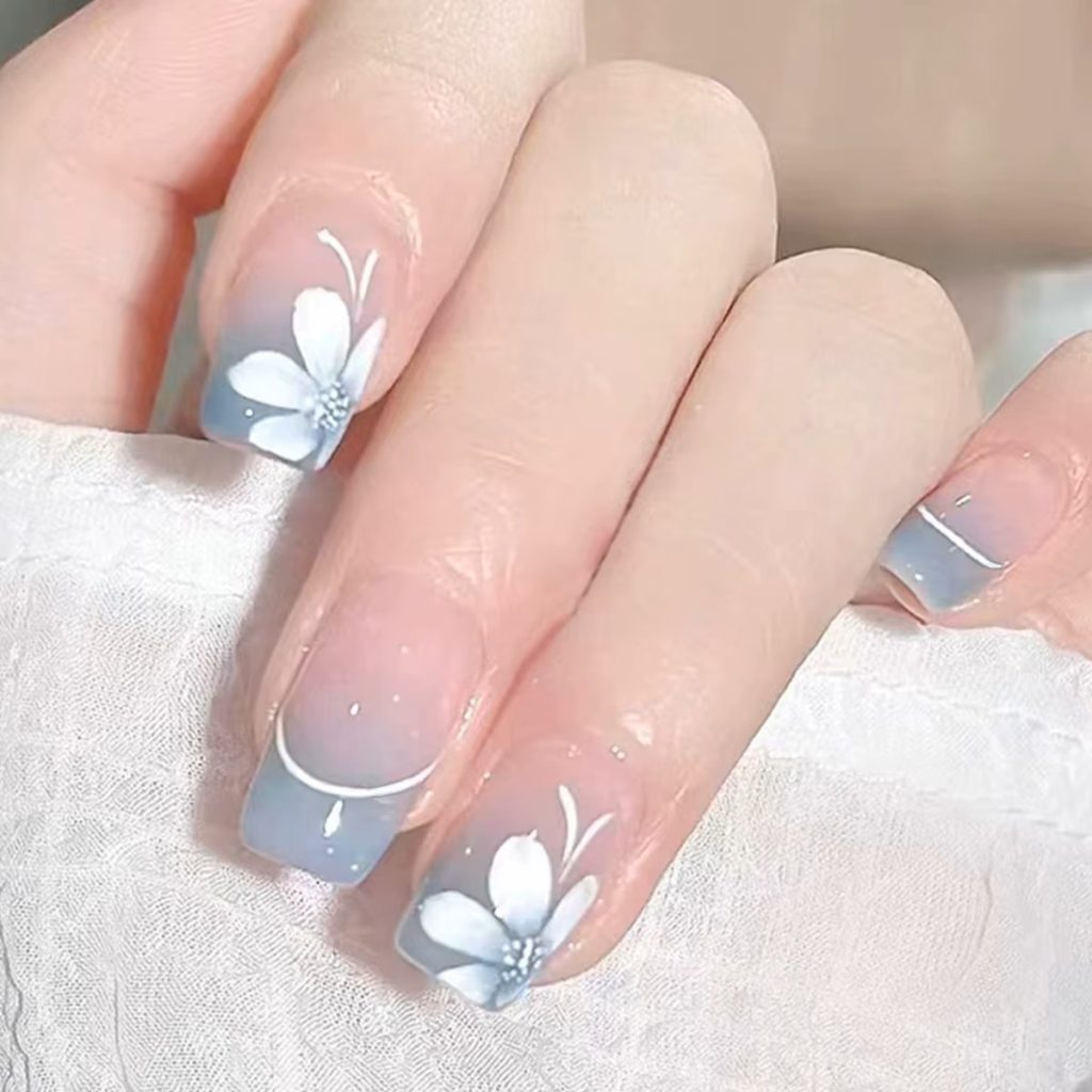 Medium square white French tip press on nails with floral butterfly nail art